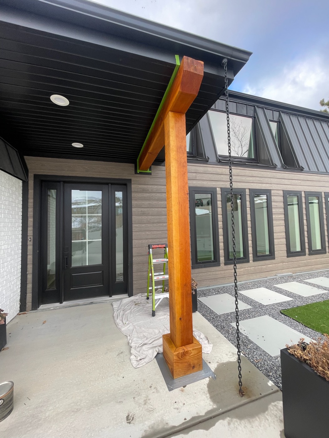 Modern front entry with timber post and covered porch